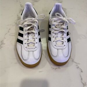 Adidas Gazelle sneakers with green and black stripes